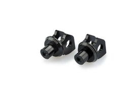 Black PUIG footpeg adapter for Kawasaki motorcycle foot controls, shown on a motorcycle footpeg.