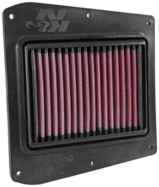 K&N PL-1115 air filter showing a rectangular, high-performance air filter with a black rubber frame and pleated filter media.