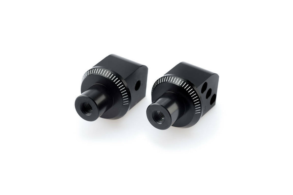 PUIG footpeg adapter for motorcycle foot controls, black metal with mounting hardware, compatible with PUIG footpegs.