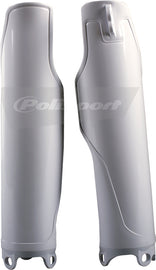Polisport Plastics white fork guards for motocross bikes, part number 64-3940, shown on a motorcycle fork assembly
