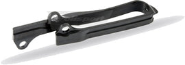 Polisport Plastics black chain slider for drive chain system, part number 64-0453, shown on a motorcycle chain.