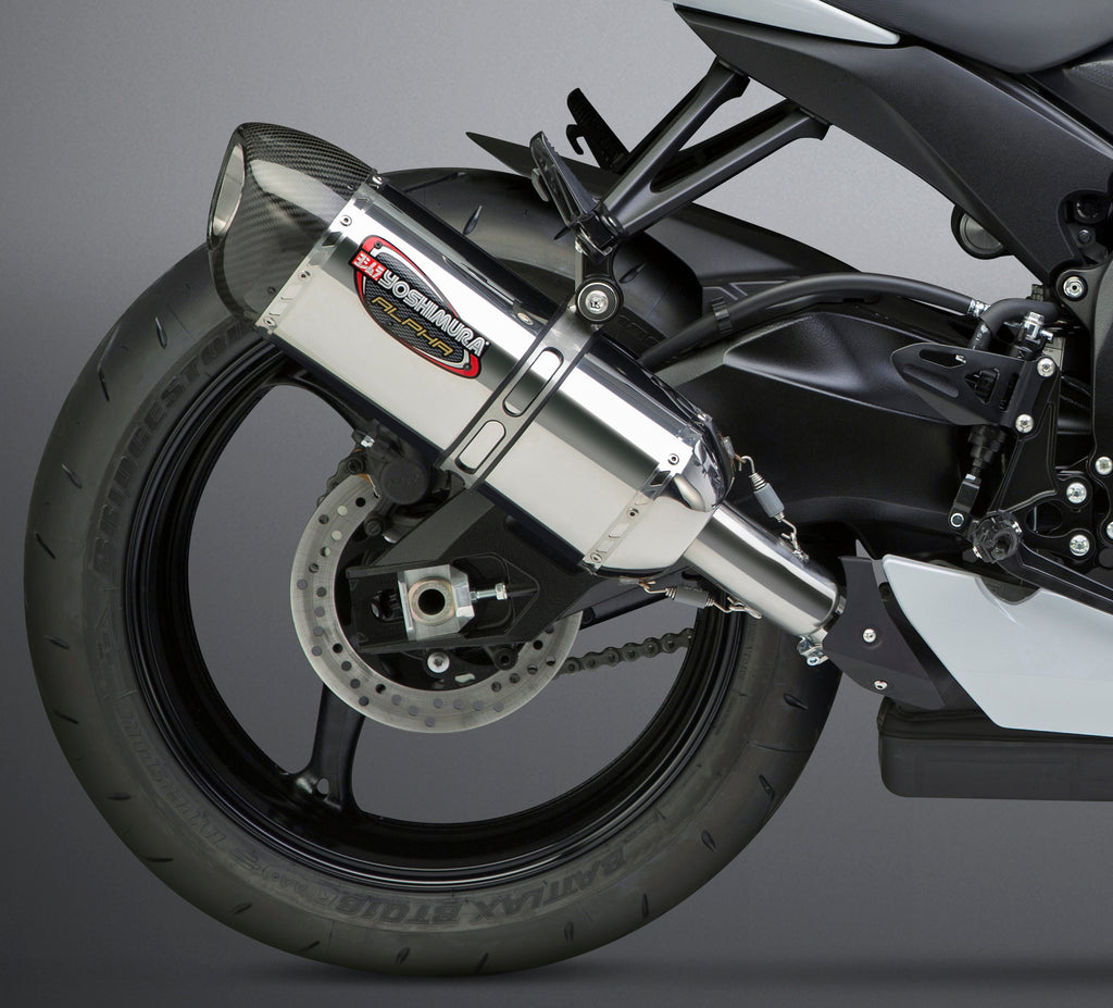 Yoshimura Signature Alpha Slip-On exhaust for motorcycle, featuring a sleek stainless steel and carbon fiber design.