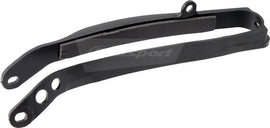 Polisport Plastics black chain slider for drive chain, model 64-0553, shown on a motorcycle drivetrain component.