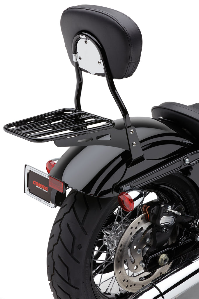 Black Cobra sissy bar luggage rack tube mounted on motorcycle, designed for Honda Yam 82-97549 with sturdy metal construction.