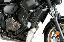 PUIG Frame Sliders Pro 2.0 in black for motorcycle protection, mounted on bike frame with visible branding and sleek design