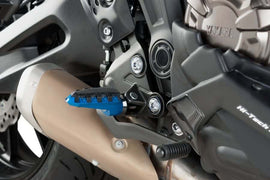 Blue PUIG Trail footpegs for motorcycle, durable foot controls with textured surface for better grip.