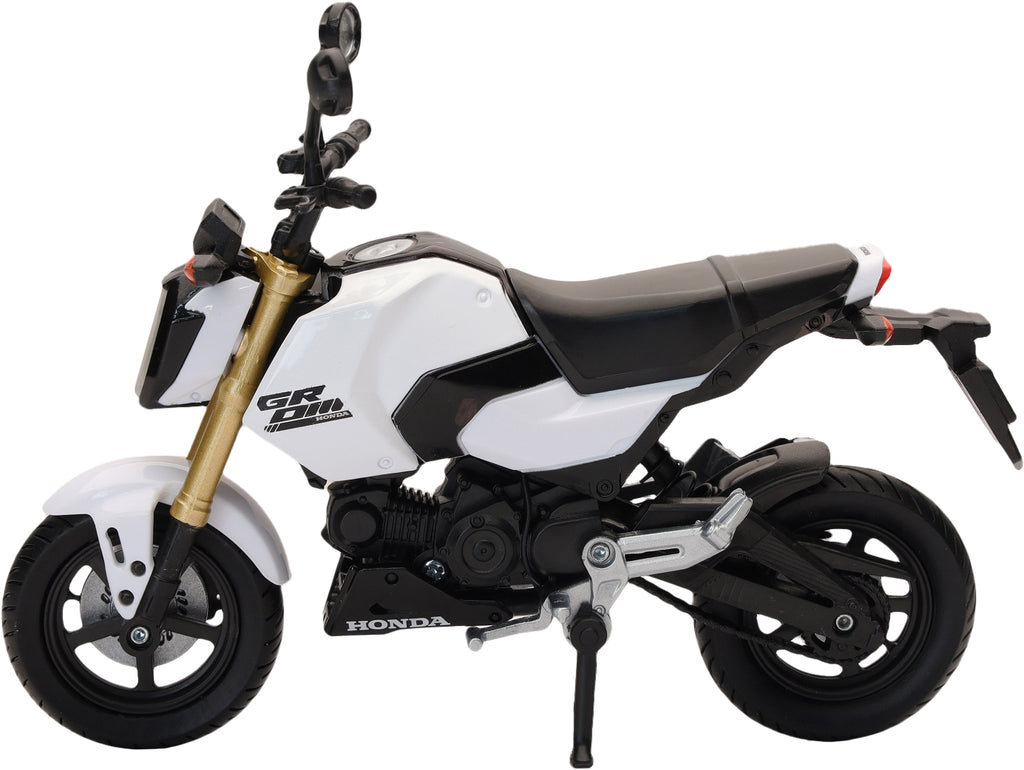 White Honda Grom replica motorcycle accessory by New Ray Toys, detailed 1:12 scale model with realistic features.