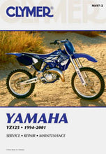 Load image into Gallery viewer, Clymer repair manual for Yamaha YZ125 motorcycle, open pages showing detailed engine and maintenance illustrations.