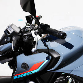 Black Shogun Industries bar end sliders installed on motorcycle handlebars, showcasing sleek body protection.
