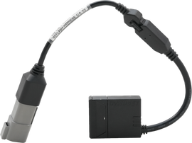 Dynojet Research Power Vision 4 engine management canister, black device with control buttons and connection ports for motorcycle tuning.