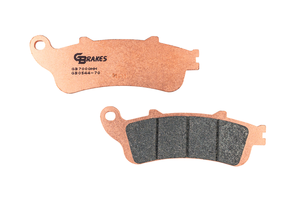 GBRAKES sintered brake pads for vehicle braking systems, showing the textured metal surface and friction material.