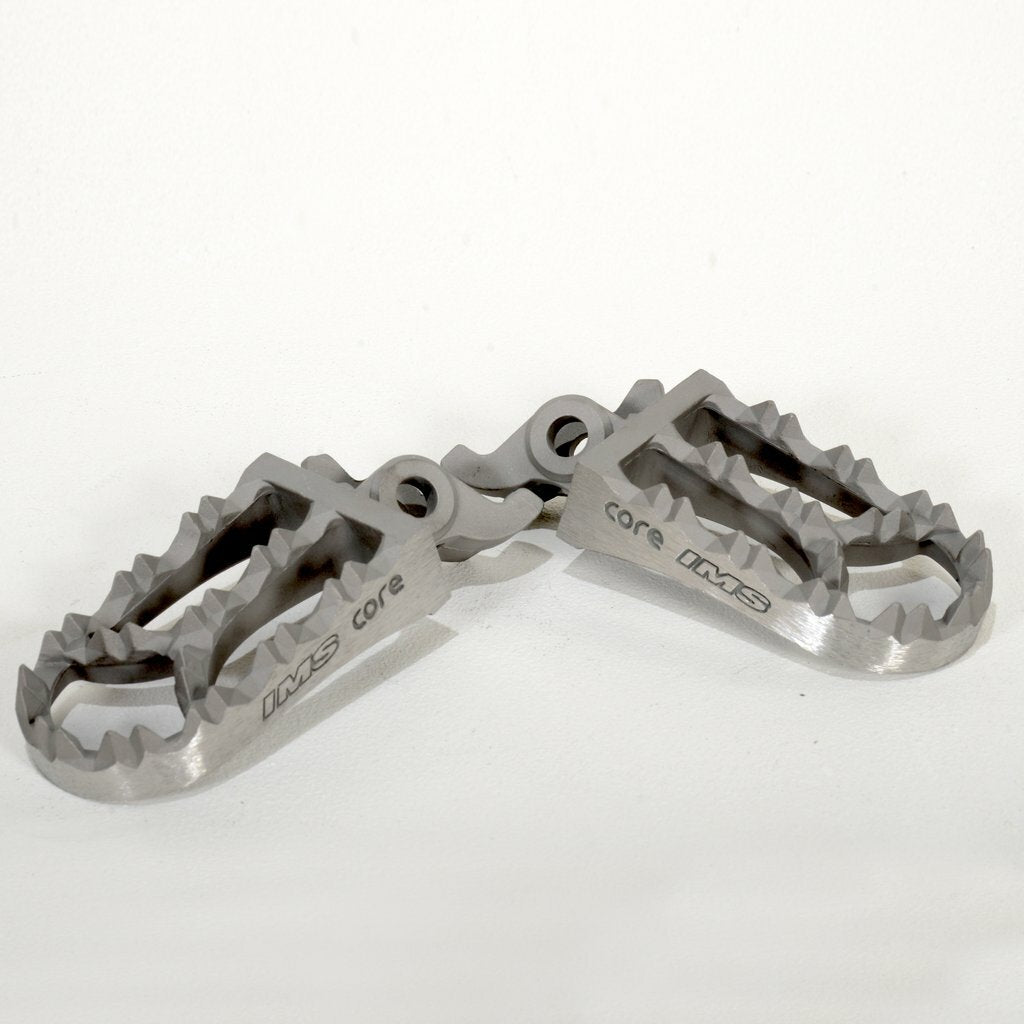 IMS Core Enduro footpegs for Kawasaki, durable metal foot controls with textured surface for grip and stability.