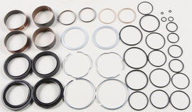 Pivot Works suspension seal and bushing kit for forks, showing various seals and bushings arranged on a white background.