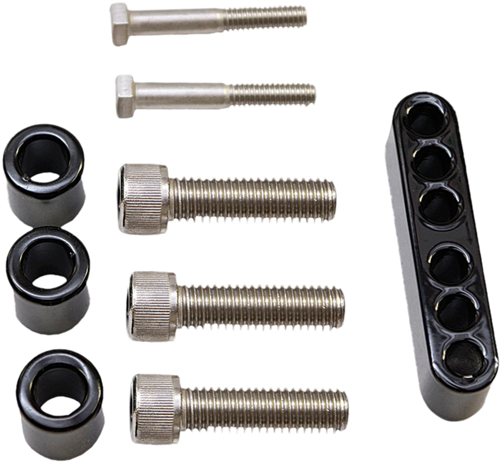 Pro Pad floorboard extension kit for foot controls, showing metal components and installation hardware in a workshop setting.