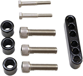 Pro Pad floorboard extension kit for foot controls, showing metal components and installation hardware in a workshop setting.