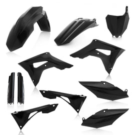 Acerbis black full plastic kit for motorcycle, featuring various plastic panels and components laid out on a white background.