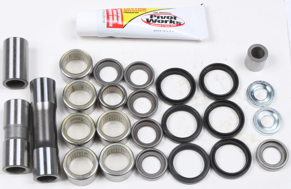 Pivot Works Suspension Linkage Rebuild Kit 52-04207, showing components laid out for motorcycle suspension maintenance.