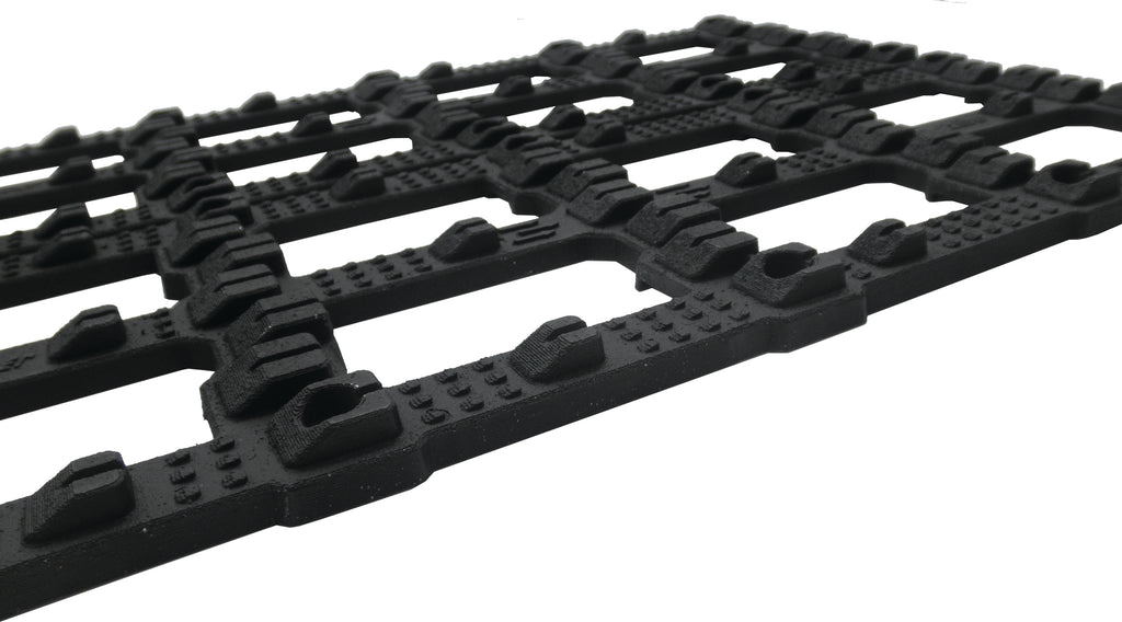 Caliber Trax Grabber trailer towing tool, pair of durable metal components with mounting brackets for vehicle towing.