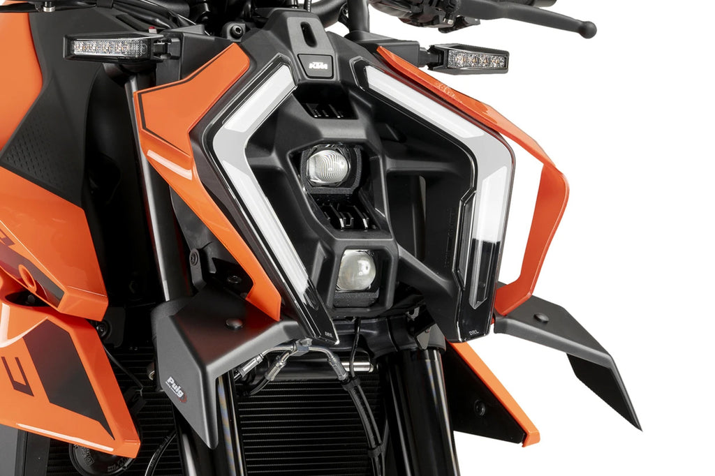 PUIG Downforce front spoiler in matte black for KTM motorcycle, body kit component with aerodynamic design.