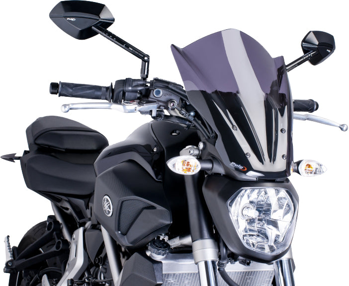 PUIG Naked New Generation touring dark smoke windshield installed on motorcycle, showing sleek tinted windscreen for enhanced rider comfort