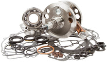 Load image into Gallery viewer, Hot Rods Bottom End Kit 421-0156 engine components including pistons, crankshaft, and connecting rods arranged on a workbench.