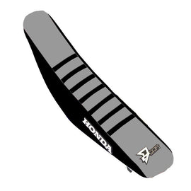 DCOR black and grey seat cover with ribbed design for CRF250/450 motorcycle, featuring durable upholstery and custom fit.