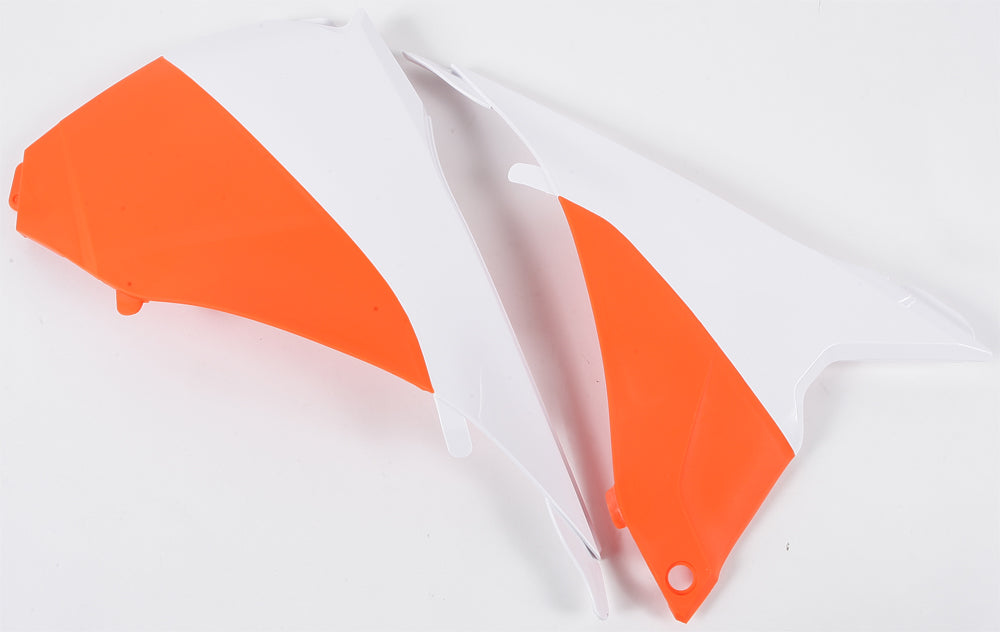 Acerbis white and orange airbox covers for motorcycles, showing the sleek design and color details of the bike accessories.