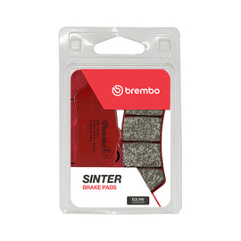 Brembo Prime Sa sintered brake pads installed in a vehicle's braking system, designed for high-performance braking.