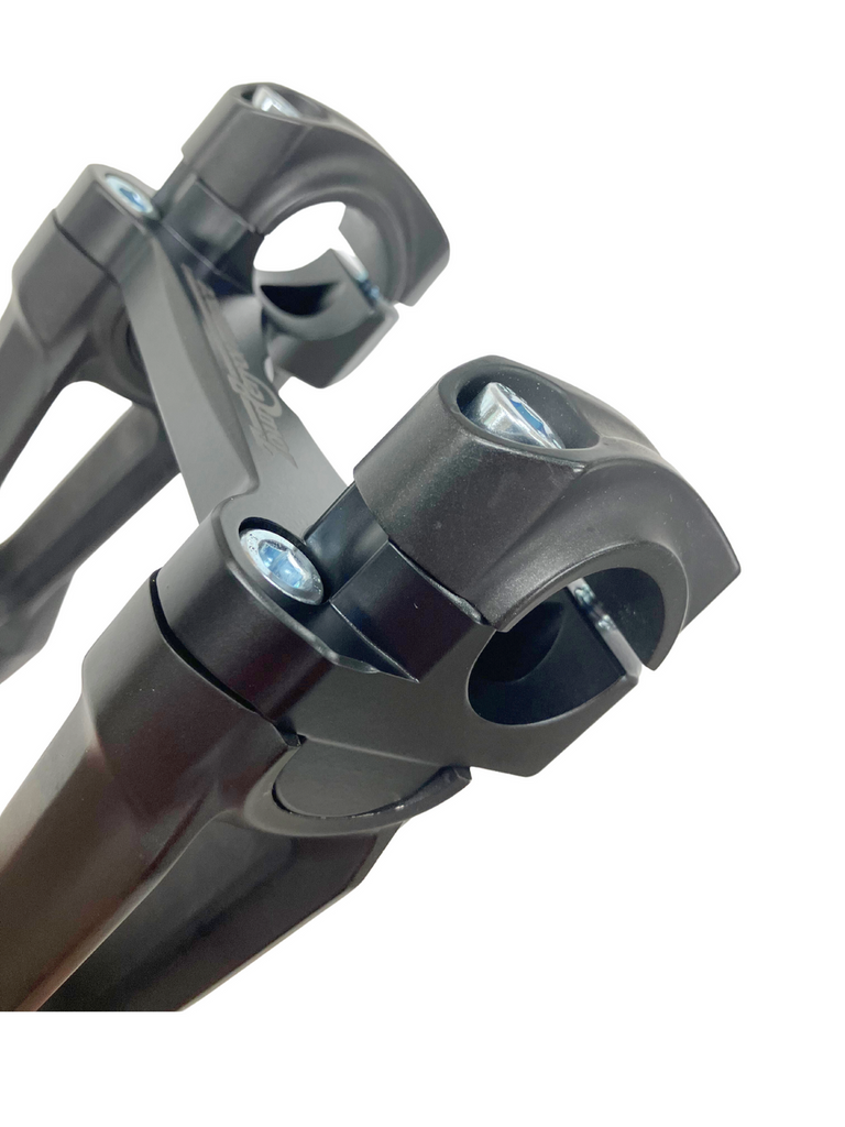 Black HeliBars handlebar risers installed on motorcycle handlebars, showcasing the sturdy, ergonomic design for improved riding comfort.