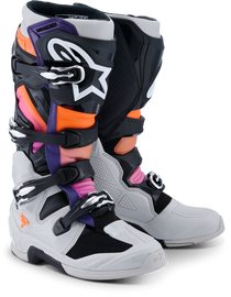 Alpine Star Tech 7 motorcycle boots in black, light gray, orange, and magenta with rugged design and protective features.
