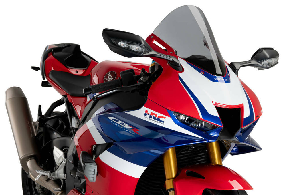 PUIG R-Racer Smoke Windscreen for motorcycle, clear tinted windshield with aerodynamic design and mounting hardware.