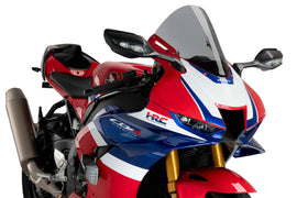 PUIG R-Racer Smoke Windscreen for motorcycle, clear tinted windshield with aerodynamic design and mounting hardware.