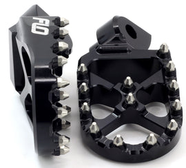 Flo Motorsports Pro Series black Cobra foot pegs for motorcycles, showcasing durable metal construction and textured grip surface.