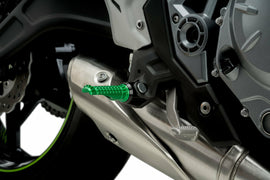 PUIG R-Fighter green motorcycle footpegs for foot controls, showing detailed green metal footrest with textured surface.
