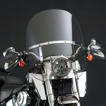 Load image into Gallery viewer, National Cycle Switchblade 2-Up Clear Fl Softail windshield mounted on a motorcycle, showcasing its transparent wind protection design.