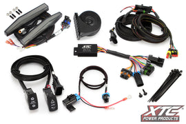 XTC POWER PRODUCTS auto turn signal kit with horn and front daytime running lights installed on a vehicle.