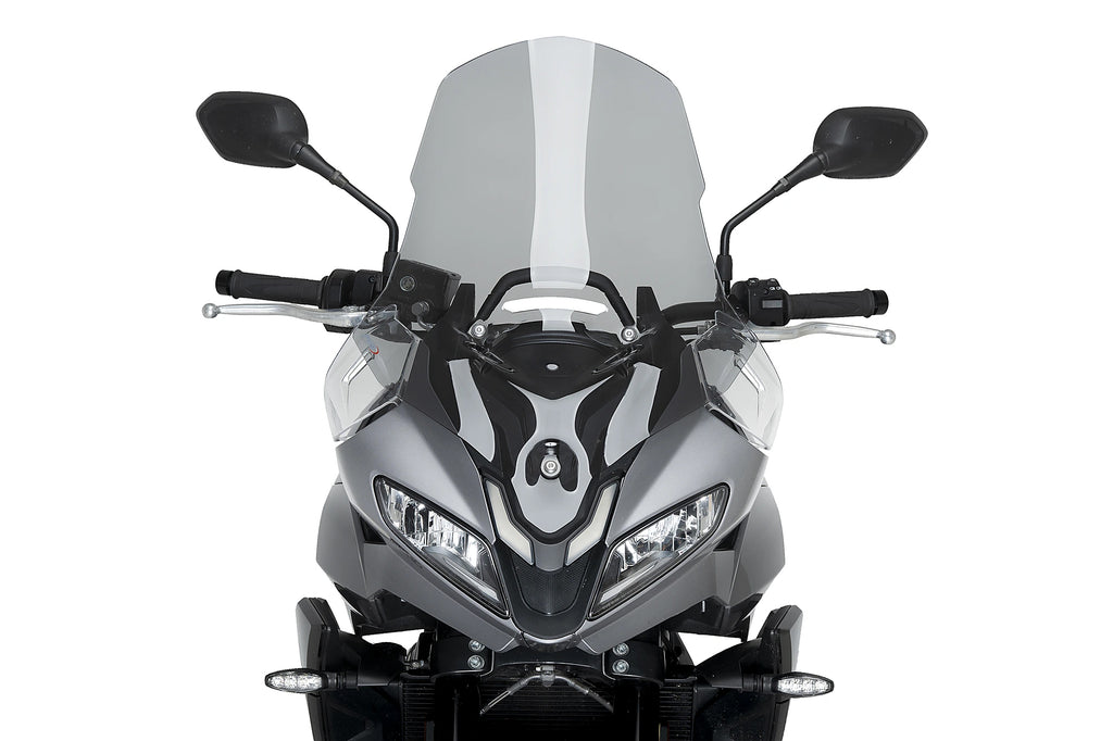 PUIG Touring Smoke Windscreen for motorcycle, clear tinted windshield with aerodynamic design and mounting hardware visible.
