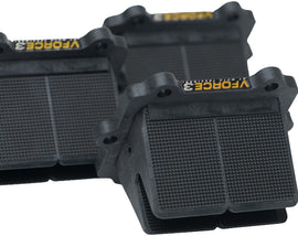 Moto Tassinari Vforce3 reed system installed on a motorcycle intake, showcasing the carbon fiber reed cages and reeds.
