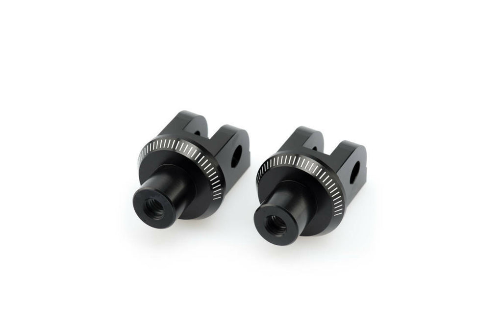 PUIG footpeg adapter 561-06347BK for motorcycle foot controls, black metal with mounting hardware visible in the image.