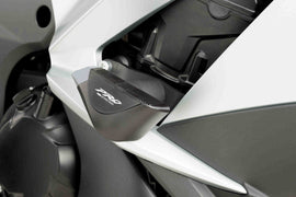 Black PUIG Frame Sliders Pro for Kawasaki motorcycle, mounted on body frame, designed for protection and style.