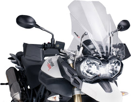 Clear PUIG touring motorcycle windscreen, sleek and aerodynamic, designed for optimal wind protection and style.