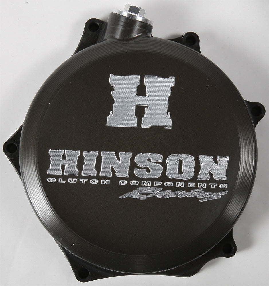Hinson clutch cover for RMZ250 engine, durable metal component with branding and mounting holes visible.