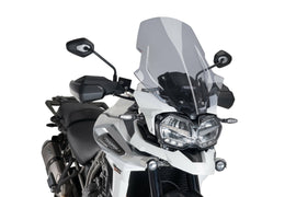 PUIG Touring Smoke Windscreen for motorcycle, side view showing tinted shield and mounting edges.