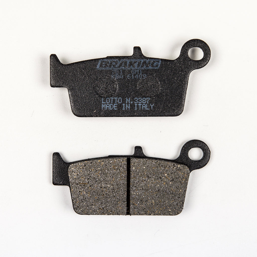 Braking semi-metallic brake pad set 31-701S for vehicle brakes, featuring two brake pads with metallic and friction material surfaces.