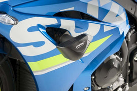 PUIG Frame Sliders Pro Black Suz 561-09370BK for motorcycle body protection, shown attached to the bike frame.