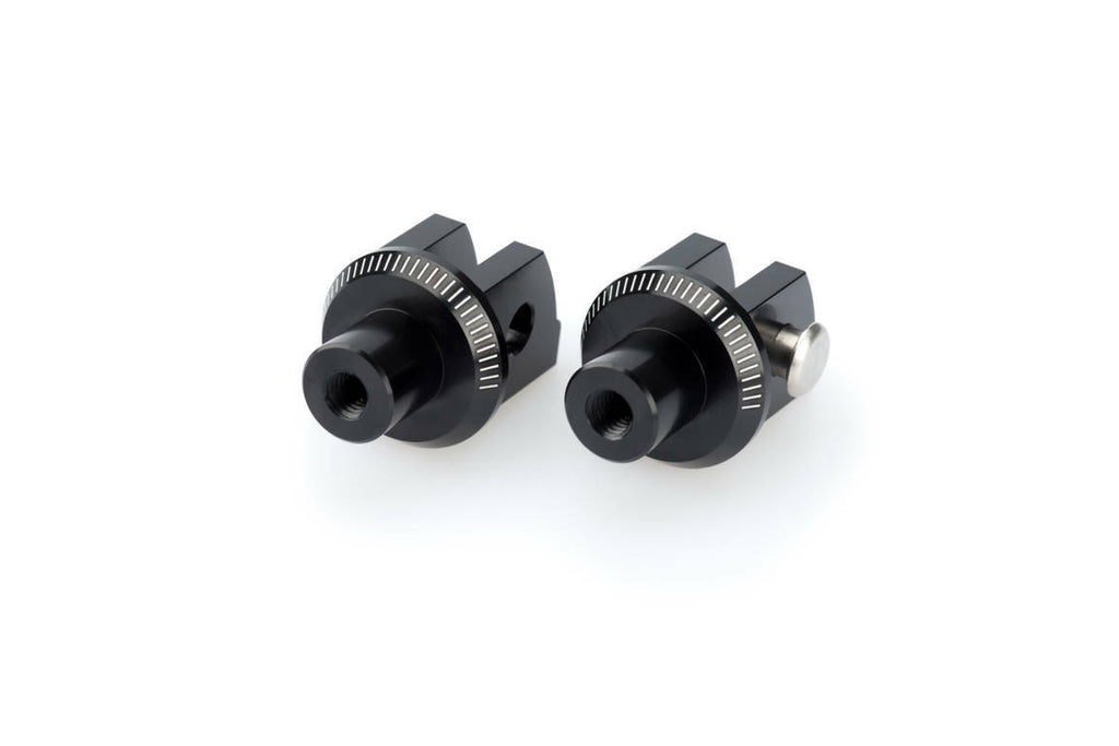 Black PUIG footpeg adapter for rider foot controls, shown with mounting details on motorcycle footpeg assembly.
