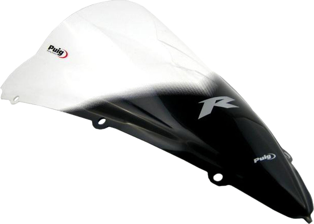 Clear PUIG racing windshield for motorcycle, aerodynamic windscreen with mounting hardware visible in the image.