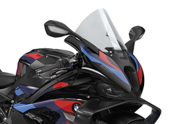 Clear PUIG R-Racer windscreen for BMW motorcycle, showing transparent windscreen with mounting edges and branding details.