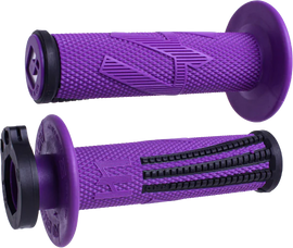 ODI Grips Emig Pro V2 lock-on grips in purple and black, designed for mountain bikes, showing close-up of textured rubber surface.