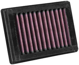K&N Air Filter 700001 for vehicle engine, showing a close-up of the high-performance reusable air filter with pleated cotton filter media.